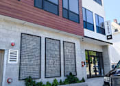 Thumbnail 33 of 36 - Contemporary building facade with mixed siding materials at 68 Beale Apartments, Massachusetts